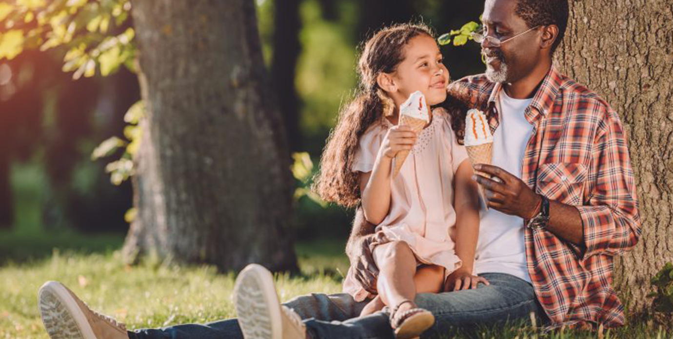 Father and daughter eating ice cream