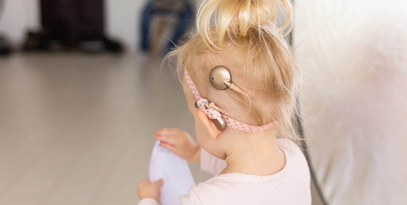Child wearing a cochlear implant