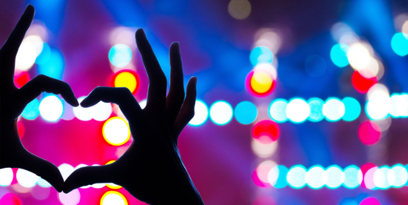 ASL sign for love with blurred background
