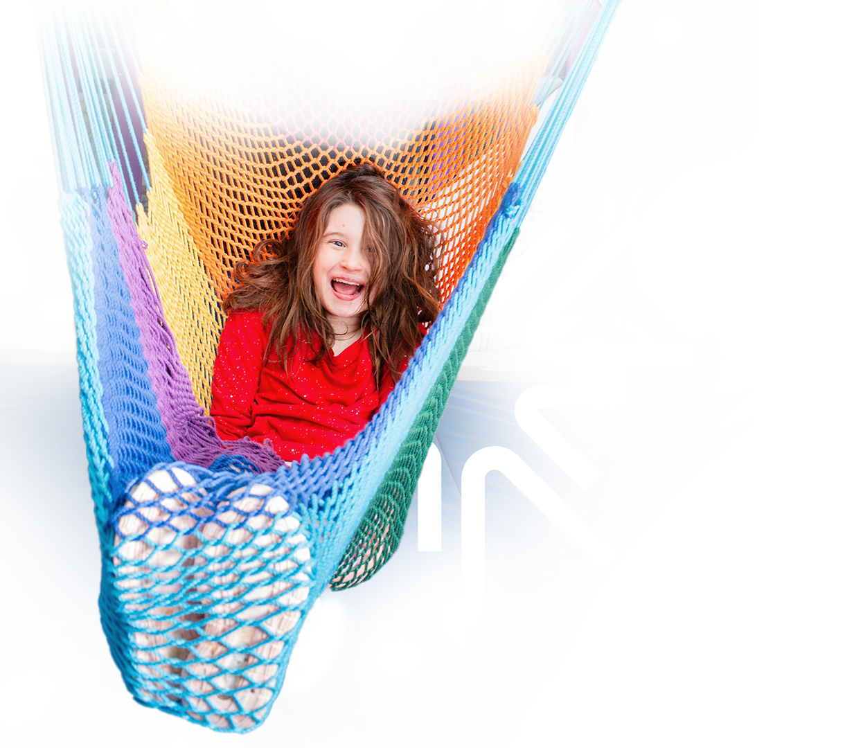 Happy child swings in hammock